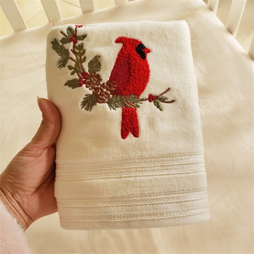Soft raised bird embroidery on textile