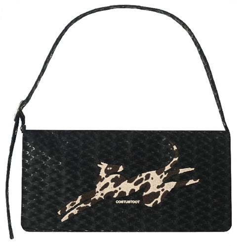 Dimensional embroidered motif on a black handbag