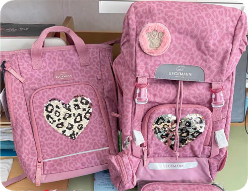 Sequin decorations on pink backpacks