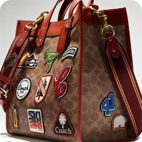 Decorative badges applied to a handbag