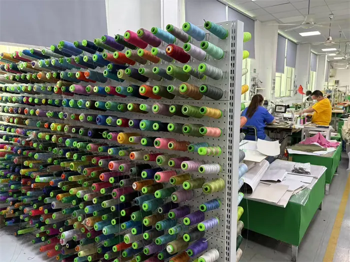 Thread color rack beside bag sewing workstations